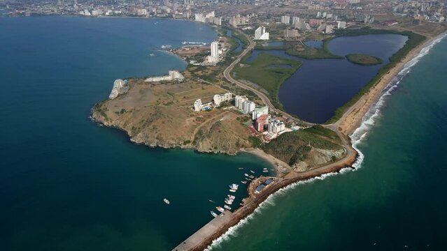 Aerial view of the coastal areas, residential real estates, and hotel accommodations in Porlamar, located in Margarita Island in the country of Venezuela.