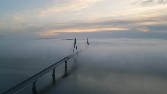 Epic cinematic shot of beautiful bridge above cold still water in amazing landscape in Northern Finland, Europe architectural