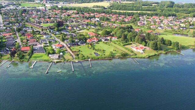 Aerial fly over the harbor and village of Middelfart Denmark during summer