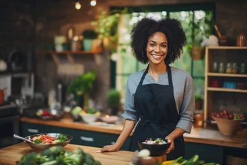 Fotobehang TV Cooking Show in Restaurant Kitchen: Portrait of Black Female Chef Talks, Teaches How to Cook Food, Online Courses, Streaming Service, Learning Video Lectures, Healthy Dish Recipe Preparation © alisaaa