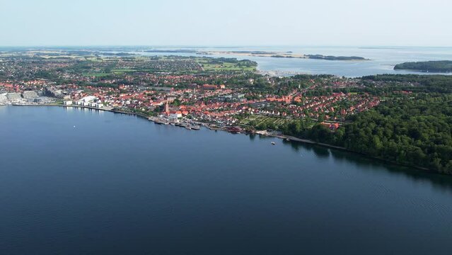 Aerial fly over the harbor and village of Middelfart Denmark during summer	