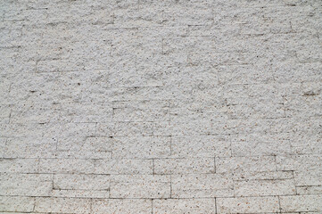 Closeup of White Small gravel wall texture and surface background for design and decoration at Thailand.