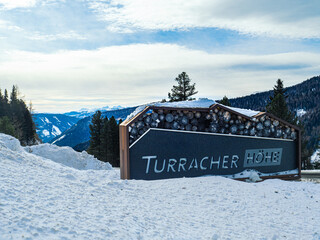 Welcome sign on a billboard in a ski resort, Turracher Höhe