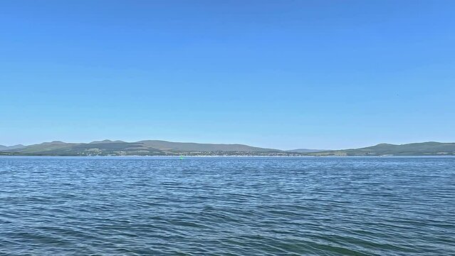 Greenock Esplanade View.  The view towards the coastal town of Helensburgh from Greenock waterfront.  Greenock is a town located on the Firth of Clyde in the west of Scotland.