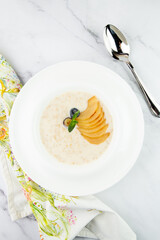 healthy breakfast with fruits in a white plate side view