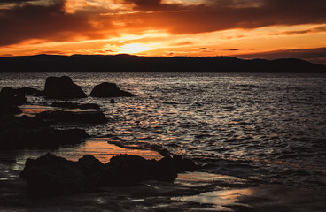 Beautiful sunset over Adriatic sea in Croatia. Colorful dusk on Croatian seaside