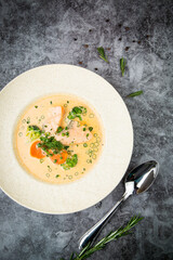 soup with fish, green onions and dill, top view
