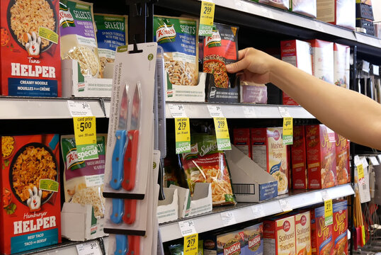 Motion of people buing instant brown rice inside price smart foods store