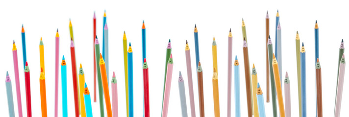 Rainbow colored wooden pencils with faces have many emotions