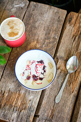 Lazy dumplings with with cream and cherry confiture. Pierogi. Top view, wooden background. vareniki.