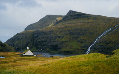 The ´lagoon seen from Saksun on Streymoy Island, Faroe Islands. The Waterfalls is filling the...