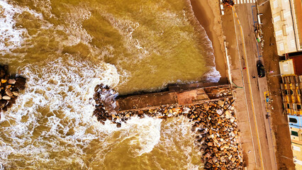 Storm in Marina di Pisa, Tuscany. Fury of the waves on the coast, aerial view on a sunny morning