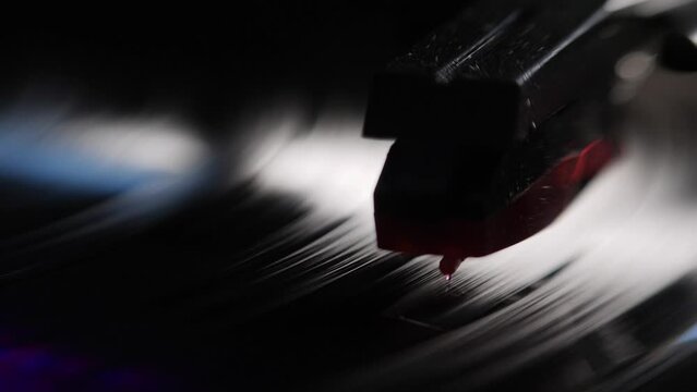 Close-up of vinyl record player turntable with its stylus running along music