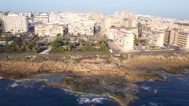 Panorama pan video of Cabo Cervera cliffs and buildings during a beautiful morning