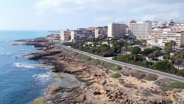 Aerial panorama of Cabo Cervera cliffs, buildings and park. Torrevieja, Costa Blanca