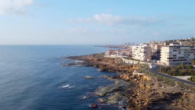 Aerial panorama shot of Cabo Cervera and La Mata beach, Torrevieja during a beautiful golden hour morning