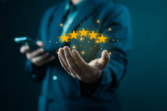 human hand showing 5-star performance that has quality and press level excellent rank for giving the best score point to review the service, business concept Customer Service Experience, and Business
