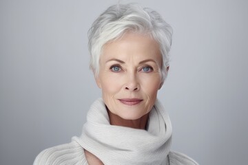 Studio portrait of an elderly beautiful, healthy woman. Lady skin and face care procedures. Concept of health, rejuvenation, plastic surgery and wellness.