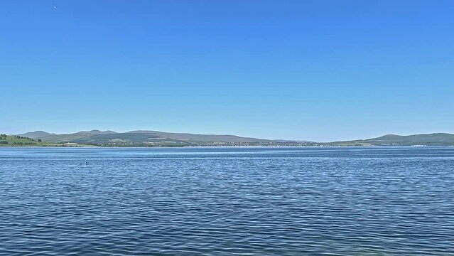 Greenock Esplanade View.  The view towards the coastal town of Helensburgh from Greenock waterfront.  Greenock is a town located on the Firth of Clyde in the west of Scotland.