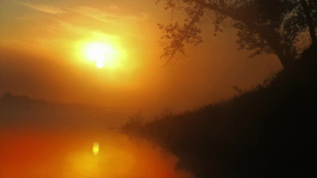 Landscape with sunrise cky over river at summer