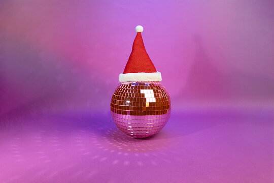 Jingle Bell Rock: A Disco Ball Adorned with Santas Hat in Festive Spirit, Nightclub Concept, Christmas Rave Party