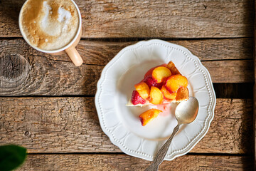 cheesecake. cottage cheese casserole with strawberry-nectarine sauce. Top view, wooden background.