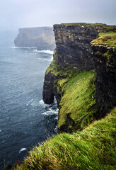 Cliffs of Moher in Ireland during the autumn rainy season - 676305192