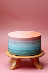 A blue and pink product display podium for natural product. Circular shape base on a wooden stand.