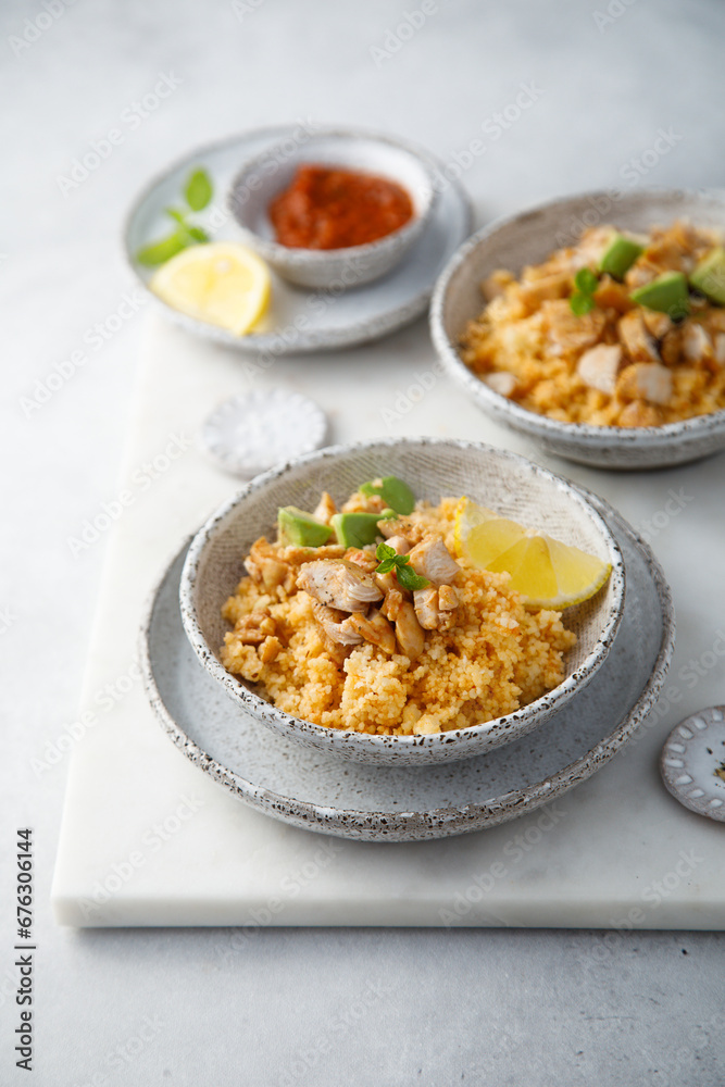 Sticker chicken with couscous and avocado