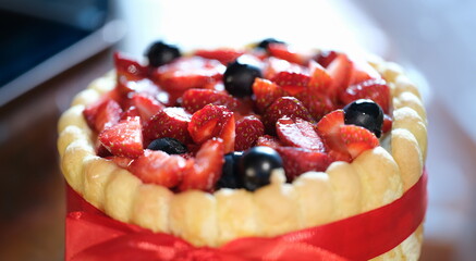 Closeup of delicious biscuit fresh strawberry cake. Home baking recipes concept