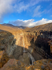 Obraz premium View from a helicopter to a high waterfall on a sunny day