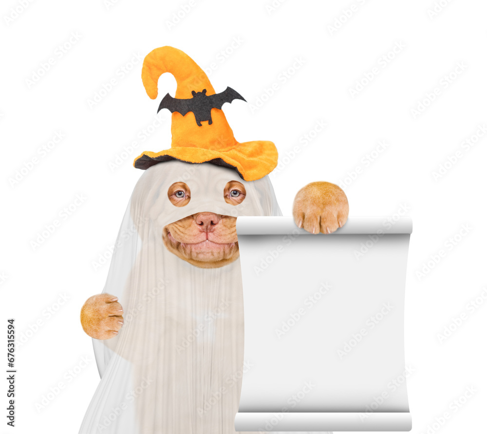 Poster Smiling Mastiff puppy dog celebrating halloween in ghost costume with funny hat showing empty list in it paw. Isolated on white background