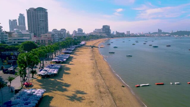 Pattaya Thailand a view of the beach road with hotels and skyscrapers buildings alongside the beach road. 