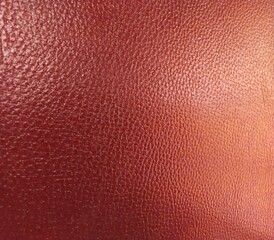 Red leather cushion texture background of vintage style chair.
