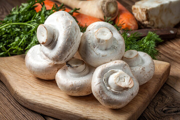 Fresh mushrooms on cutting board.