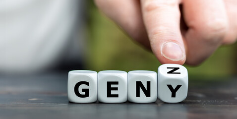 Hand turns dice and changes the expression 'GEN Y' to 'GEN Z'.