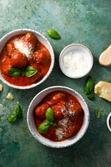 Homemade meatballs with tomato sauce and cheese