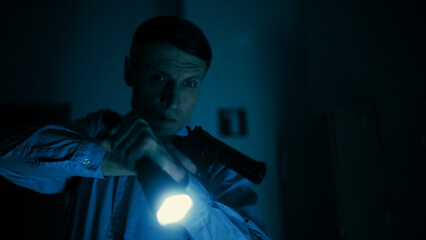 A detective is chasing a criminal with a gun while searching for an abducted person in a dark...