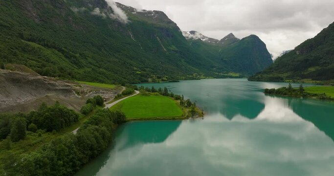 Drone flight over Oldevatnet lake in scenic Oldedalen valley, Norway