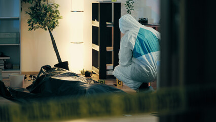 A forensic expert is collecting samples near a corpse in a body bag at the murder scene - obrazy, fototapety, plakaty