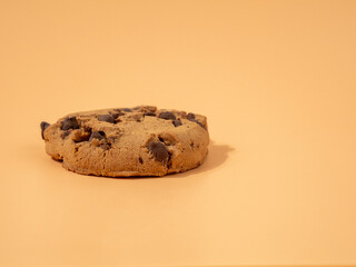 Oatmeal cookies with chocolate chips on an orange background. Classic oatmeal cookies with chocolate.