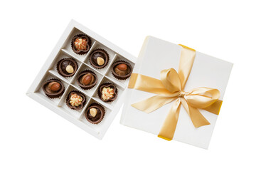 Chocolate candy in a box with a colored bow. Gift box with Chocolates isolated on white top view