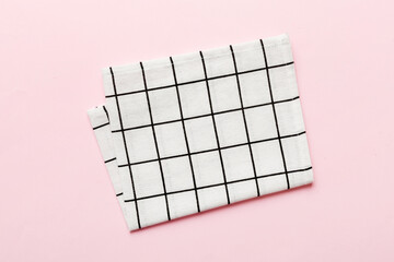 top view with white empty kitchen napkin isolated on table background. Folded cloth for mockup with...
