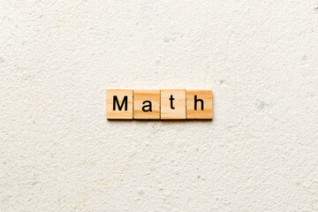 math word written on wood block. math text on table, concept