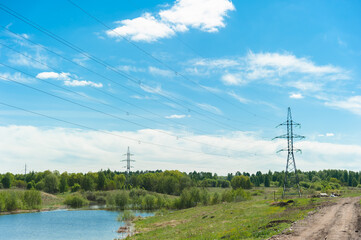 Power lines for transmitting energy over long distances. Landscape of a big country.