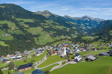 Fototapeta na wymiar Village of Raggal in the Grosswalsertal Valley, State of Vorarlberg, Austria. Drone Picture