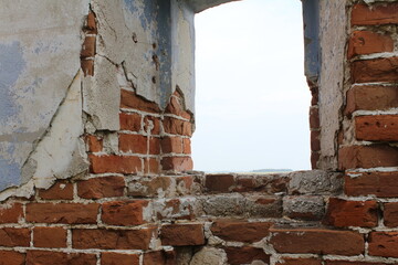 View from the window of an old abandoned building to the sky