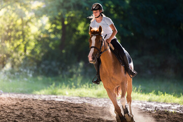  woman riding a horse