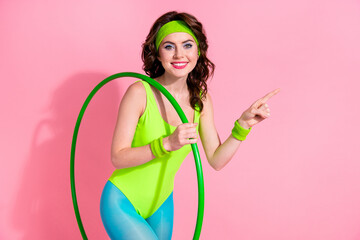 Photo of sporty lady coach with hula hoop demonstrate sport store offer for buying equipment isolated pastel color background