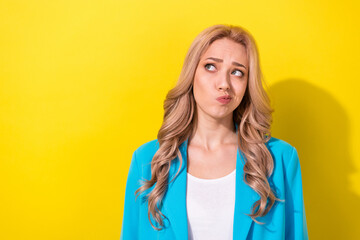 Portrait of gorgeous minded dountful person look interested empty space ponder isolated on yellow...